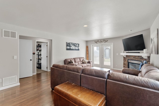 9805 N Jesse Ct, Spokane, WA 99208 - living area featuring wood finished floors, a fireplace, and recessed lighting