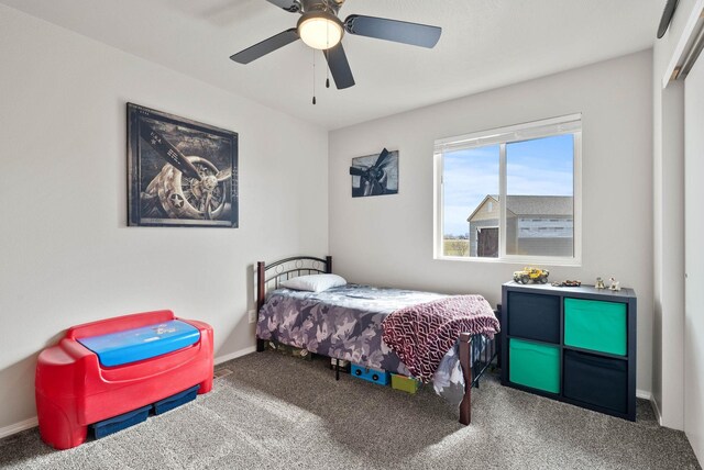 9805 N Jesse Ct, Spokane, WA 99208 - carpeted bedroom with baseboards and ceiling fan