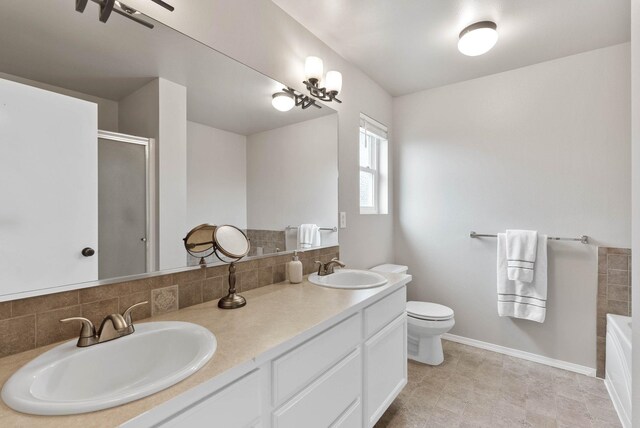 9805 N Jesse Ct, Spokane, WA 99208 - full bath featuring decorative backsplash, double vanity, an enclosed shower, and a garden tub