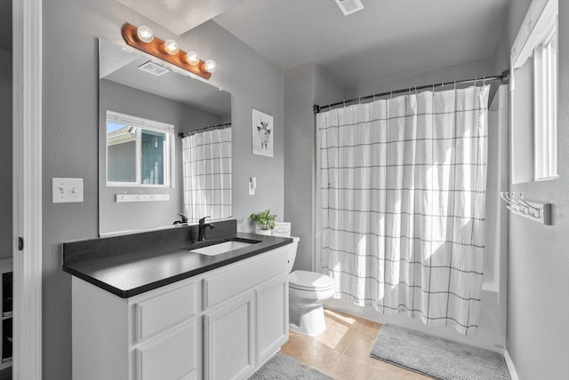 9805 N Jesse Ct, Spokane, WA 99208 - bathroom featuring vanity, tile patterned floors, and shower / bathtub combination with curtain