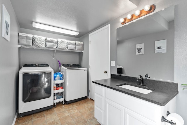 9805 N Jesse Ct, Spokane, WA 99208 - washroom featuring washer and clothes dryer and a textured ceiling