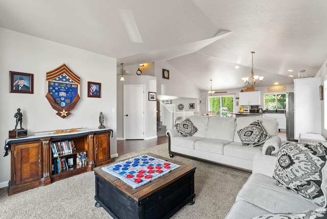 9805 N Jesse Ct, Spokane, WA 99208 - living room with a chandelier, light colored carpet, stairway, vaulted ceiling, and recessed lighting
