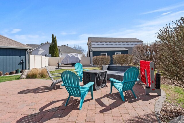9805 N Jesse Ct, Spokane, WA 99208 - fenced backyard with a patio area and outdoor lounge area
