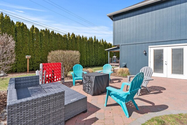 9805 N Jesse Ct, Spokane, WA 99208 - view of patio / terrace featuring french doors and a view of trees