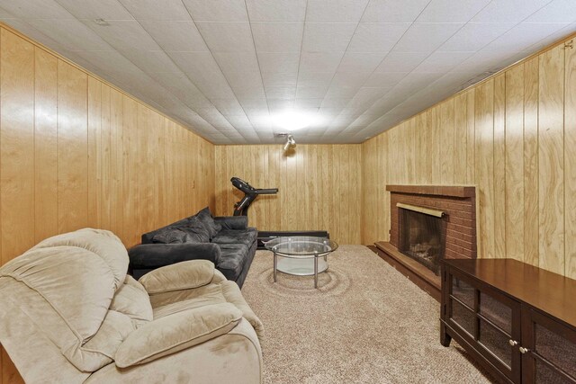 2620 S Pines Rd, Spokane Valley, WA 99206 - living room featuring wooden walls, carpet flooring, and a fireplace
