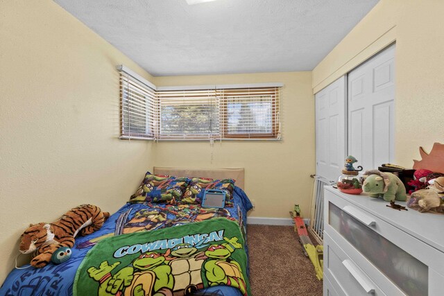 2620 S Pines Rd, Spokane Valley, WA 99206 - carpeted bedroom featuring a textured ceiling and a closet