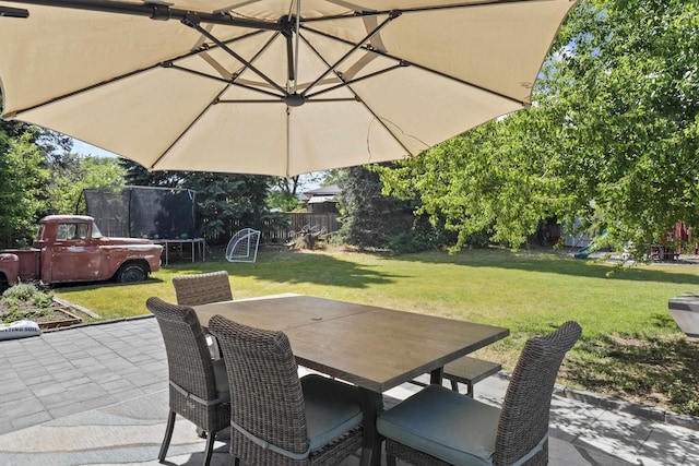 2620 S Pines Rd, Spokane Valley, WA 99206 - view of patio / terrace with a trampoline and outdoor dining area