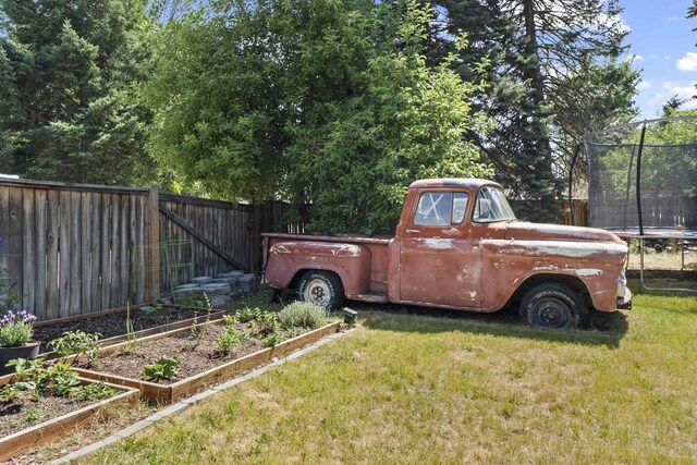 2620 S Pines Rd, Spokane Valley, WA 99206 - view of yard with a trampoline and a garden