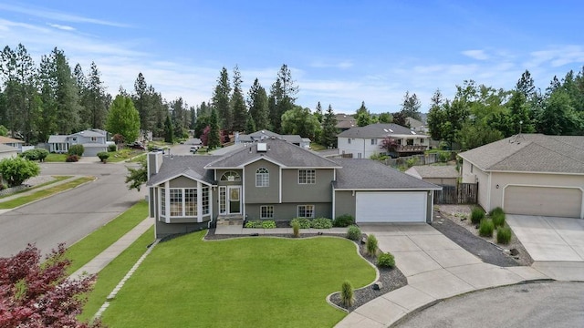 8805 N Greenwood St, Spokane, WA 99208 - tri-level home featuring concrete driveway and a residential view