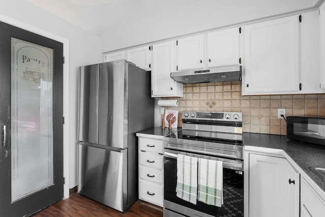 8805 N Greenwood St, Spokane, WA 99208 - kitchen featuring stainless steel appliances, under cabinet range hood, dark countertops, white cabinetry, and backsplash