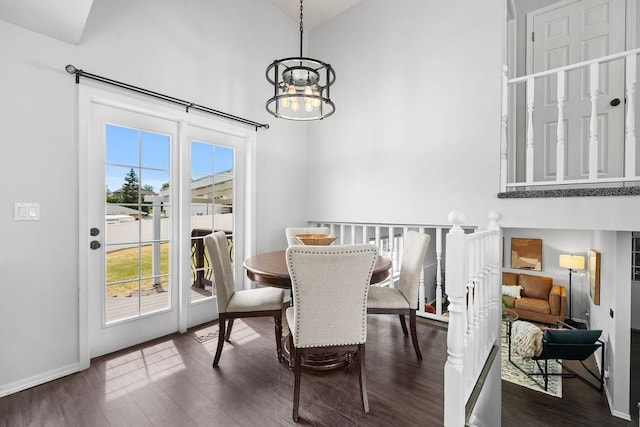 8805 N Greenwood St, Spokane, WA 99208 - dining space featuring a chandelier, healthy amount of natural light, dark wood-style flooring, and a towering ceiling