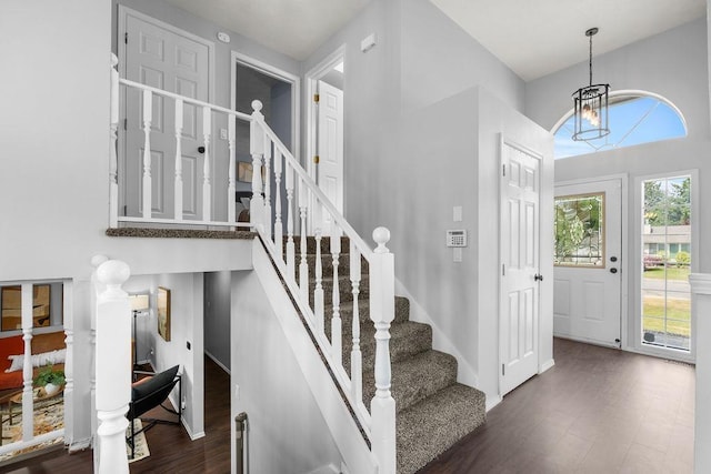 8805 N Greenwood St, Spokane, WA 99208 - stairway with a chandelier and wood finished floors