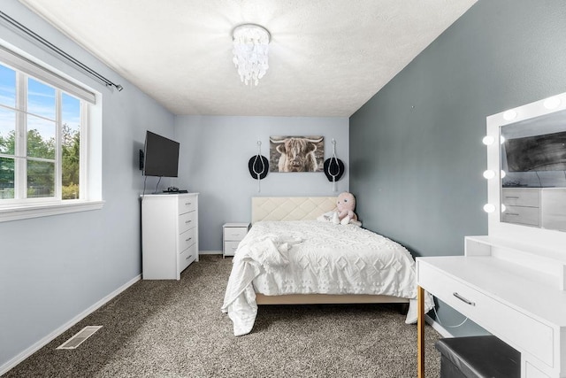 8805 N Greenwood St, Spokane, WA 99208 - carpeted bedroom with a closet, ceiling fan, and a textured ceiling