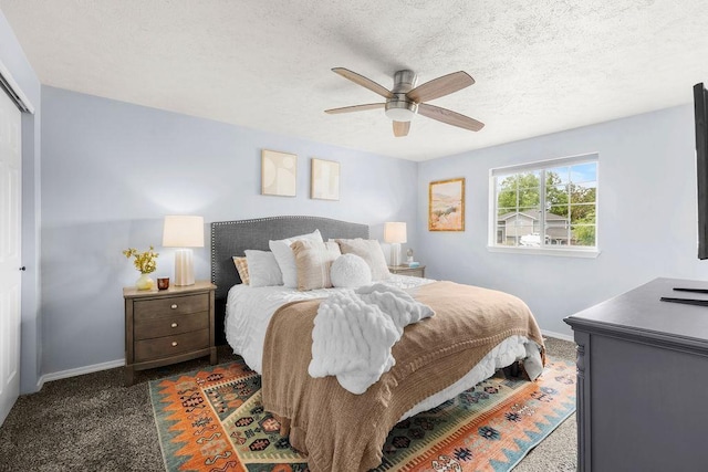 8805 N Greenwood St, Spokane, WA 99208 - carpeted bedroom with multiple closets, ceiling fan, and a textured ceiling