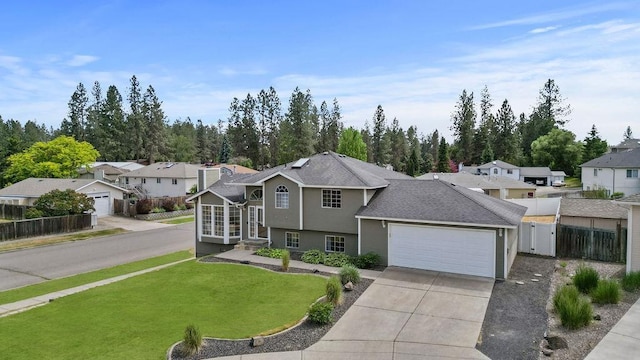 8805 N Greenwood St, Spokane, WA 99208 - view of front of home featuring an attached garage, driveway, a residential view, and roof with shingles