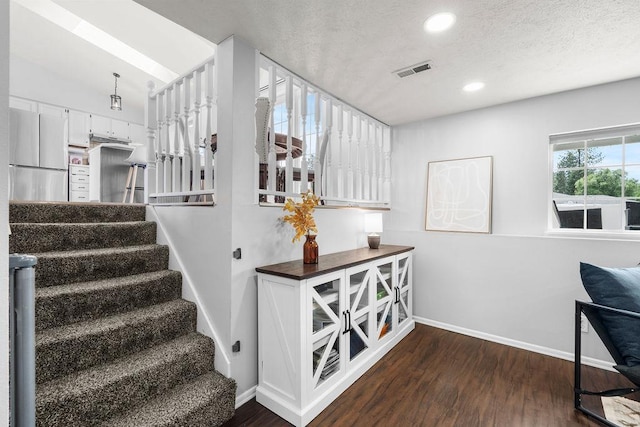 8805 N Greenwood St, Spokane, WA 99208 - spare room featuring a textured ceiling and carpet flooring