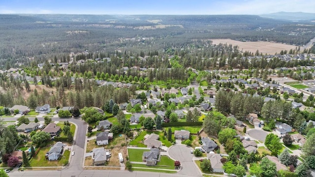 8805 N Greenwood St, Spokane, WA 99208 - aerial view of property's location featuring a heavily wooded area and nearby suburban area