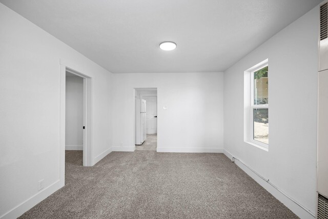 1608 W Maxwell Ave, Spokane, WA 99201 - unfurnished room featuring carpet floors and baseboards