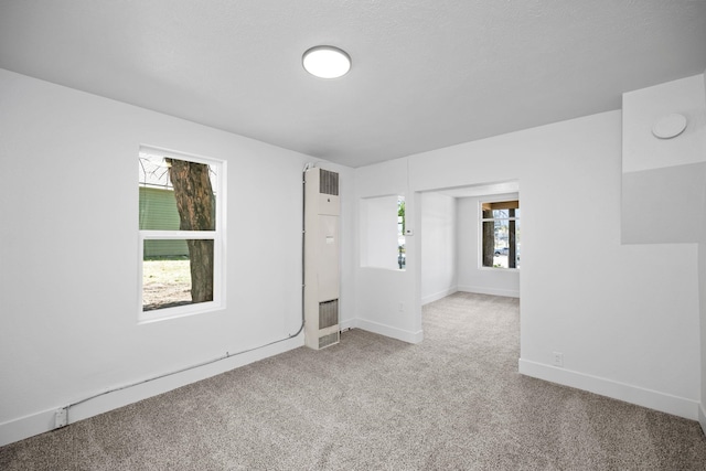 1608 W Maxwell Ave, Spokane, WA 99201 - carpeted empty room featuring a heating unit and baseboards