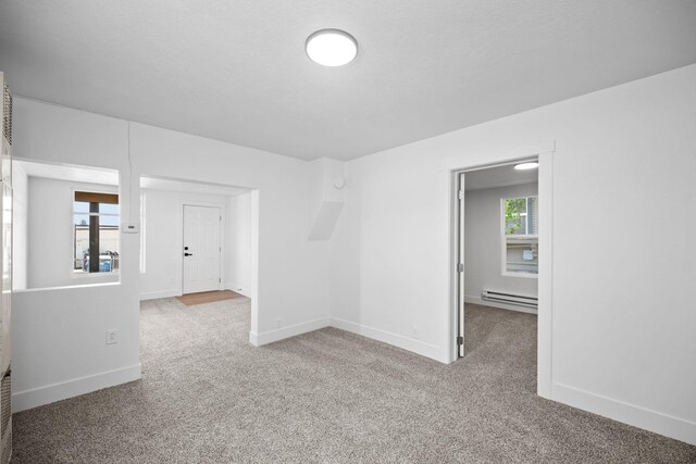 1608 W Maxwell Ave, Spokane, WA 99201 - spare room with a baseboard heating unit and carpet