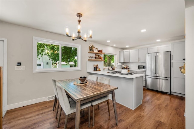 2804 E 39th Ave, Spokane, WA 99223 - dining space with a chandelier, wood finished floors, and recessed lighting