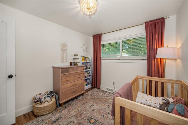 2804 E 39th Ave, Spokane, WA 99223 - bedroom featuring a nursery area and light wood finished floors