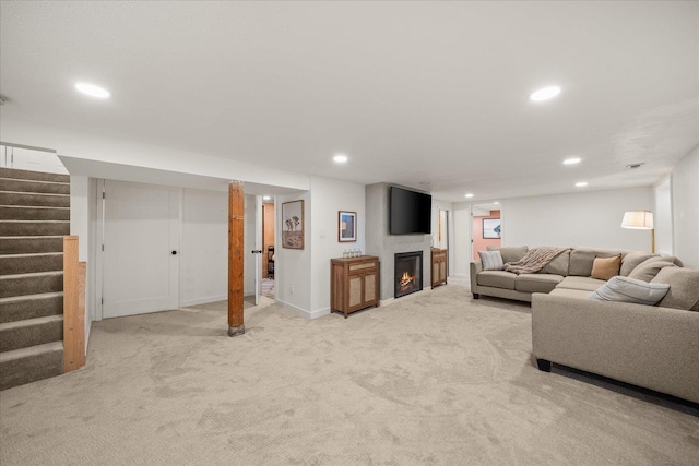 2804 E 39th Ave, Spokane, WA 99223 - living area featuring stairs, recessed lighting, light colored carpet, and a warm lit fireplace