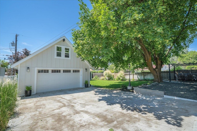 2804 E 39th Ave, Spokane, WA 99223 - view of front of house featuring board and batten siding, a detached garage, and an outbuilding
