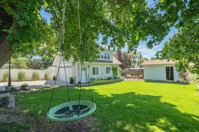2804 E 39th Ave, Spokane, WA 99223 - fenced yard with driveway, a garage, and an outbuilding