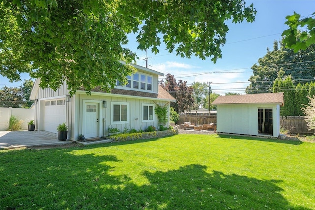 2804 E 39th Ave, Spokane, WA 99223 - view of yard featuring driveway, a garage, and an outbuilding