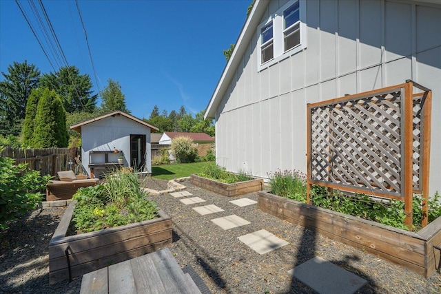 2804 E 39th Ave, Spokane, WA 99223 - view of patio featuring a garden and an outdoor structure