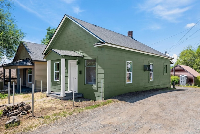 1509 N Maple St, Spokane, WA 99201 - view of property exterior with roof with shingles and a chimney