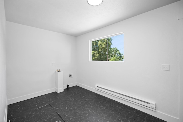 1509 N Maple St, Spokane, WA 99201 - spare room featuring a baseboard radiator and dark floors