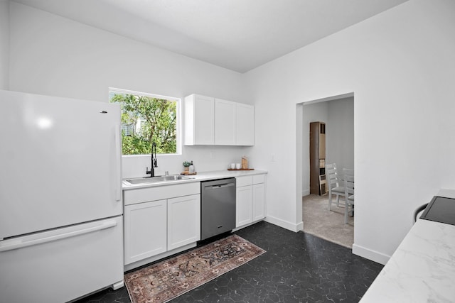 1509 N Maple St, Spokane, WA 99201 - kitchen featuring freestanding refrigerator, stainless steel dishwasher, white cabinets, dark flooring, and light stone countertops