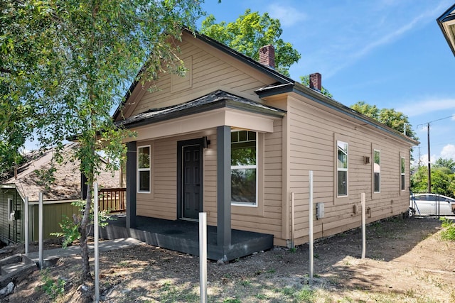 1507 N Maple St, Spokane, WA 99201 - view of home's exterior with a chimney and a porch