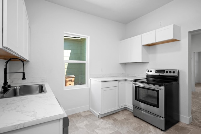 1507 N Maple St, Spokane, WA 99201 - kitchen with stainless steel range with electric stovetop, light countertops, and white cabinets
