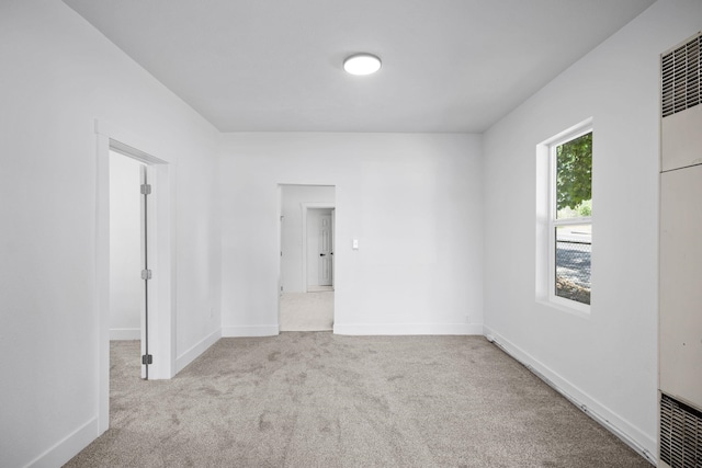 1604 W Maxwell Ave, Spokane, WA 99201 - empty room featuring carpet floors and a heating unit