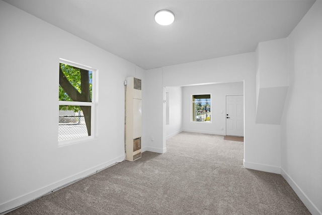 1604 W Maxwell Ave, Spokane, WA 99201 - spare room with a heating unit, healthy amount of natural light, and carpet floors