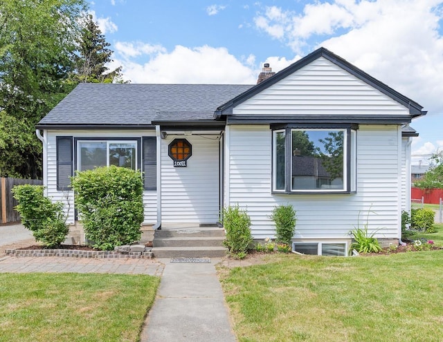 10021 N Whittier St, Spokane, WA 99218 - bungalow-style home with a chimney and roof with shingles
