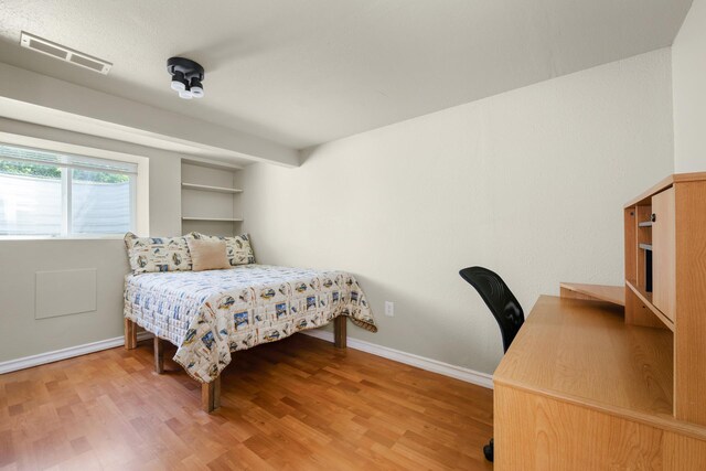 10021 N Whittier St, Spokane, WA 99218 - bedroom featuring light wood-style flooring and a desk