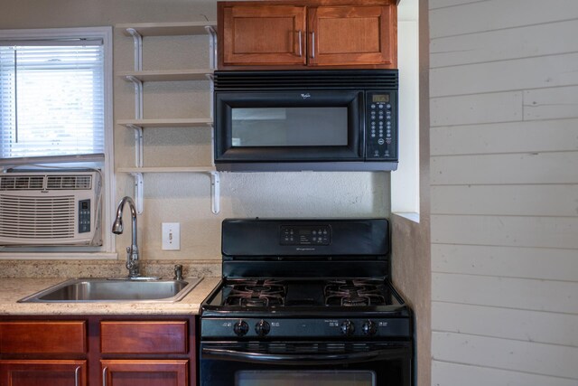 10021 N Whittier St, Spokane, WA 99218 - kitchen with black appliances, light countertops, open shelves, wood walls, and brown cabinets