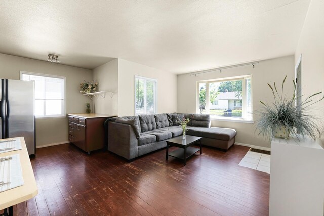 10021 N Whittier St, Spokane, WA 99218 - living area featuring dark wood-style floors and healthy amount of natural light