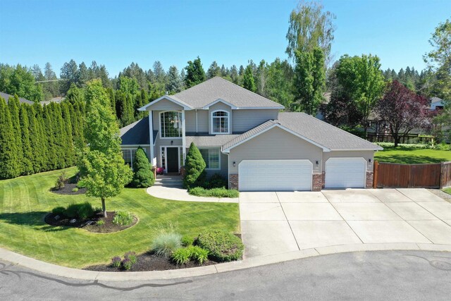 5522 E Cargill Ln, Colbert, WA 99005 - view of front facade featuring an attached garage, driveway, and roof with shingles