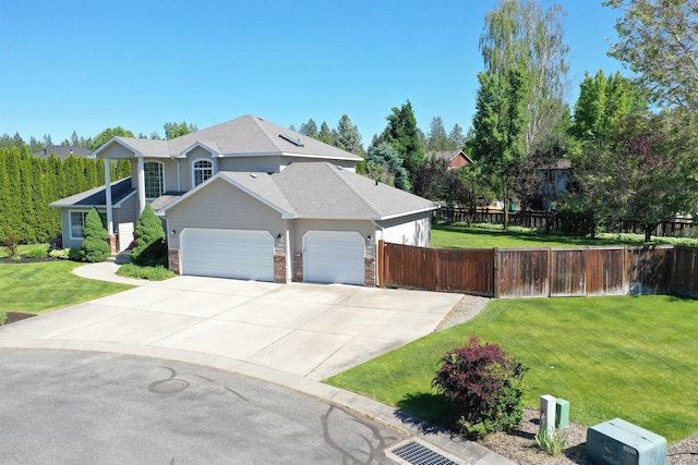 5522 E Cargill Ln, Colbert, WA 99005 - view of front facade featuring an attached garage, driveway, brick siding, and a gate