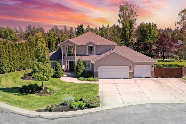 5522 E Cargill Ln, Colbert, WA 99005 - view of front of house featuring an attached garage, concrete driveway, and stone siding