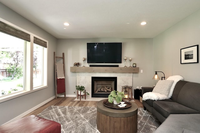 5522 E Cargill Ln, Colbert, WA 99005 - living room with healthy amount of natural light, wood finished floors, recessed lighting, and a tiled fireplace