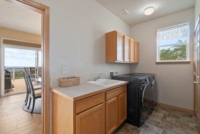 5506 S Southview Ln, Spokane, WA 99223 - laundry area featuring cabinet space and washing machine and clothes dryer