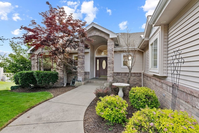 5506 S Southview Ln, Spokane, WA 99223 - view of exterior entry with brick siding and a lawn