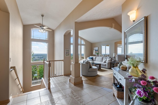 5506 S Southview Ln, Spokane, WA 99223 - tiled entrance foyer with arched walkways, vaulted ceiling, healthy amount of natural light, and a ceiling fan