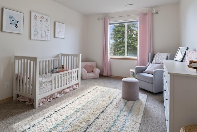5506 S Southview Ln, Spokane, WA 99223 - carpeted bedroom featuring a crib and baseboards